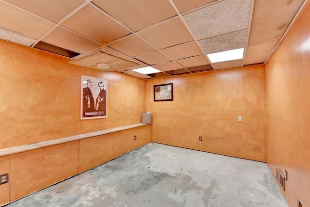 basement featuring a paneled ceiling