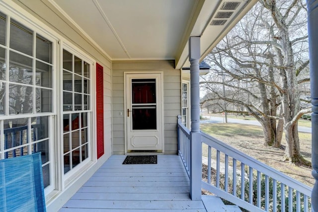 doorway to property with a porch