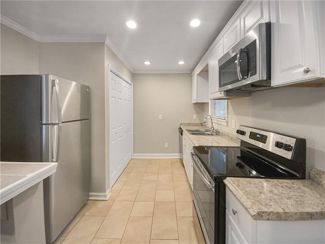 kitchen featuring sink, white cabinets, ornamental molding, and appliances with stainless steel finishes