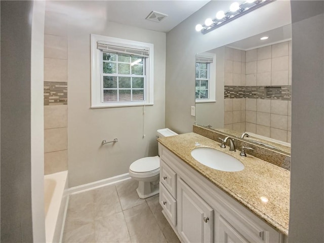 bathroom featuring vanity, tile patterned floors, and toilet