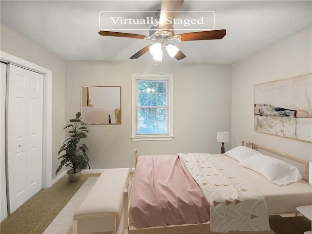 bedroom featuring ceiling fan, a closet, and carpet flooring