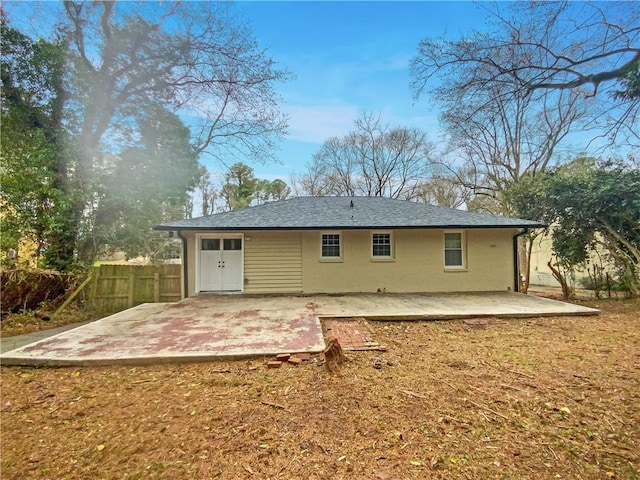 back of house with a patio