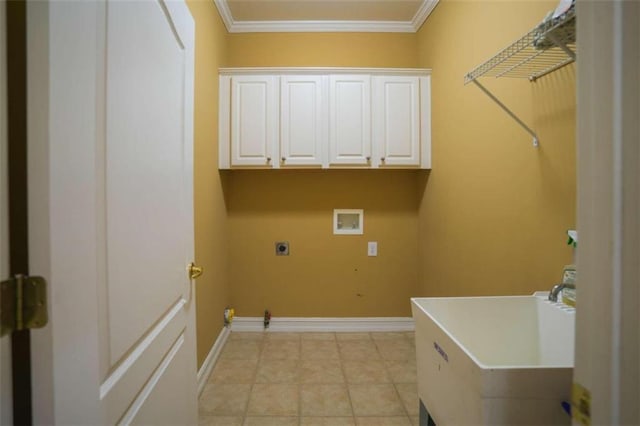 clothes washing area featuring electric dryer hookup, hookup for a washing machine, ornamental molding, light tile patterned flooring, and cabinets