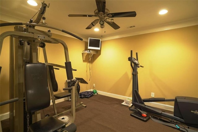 workout room featuring ceiling fan and ornamental molding