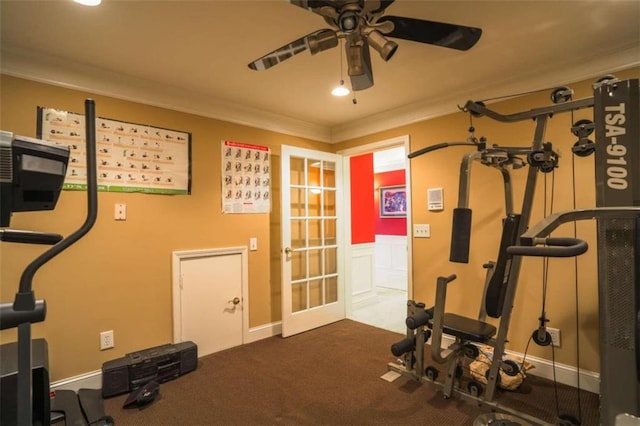 exercise area featuring ornamental molding, carpet flooring, and ceiling fan