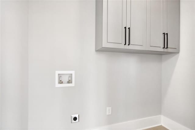 106 Hogue St, Atlanta, GA 30312 - washroom featuring electric dryer hookup, washer hookup, cabinet space, and baseboards
