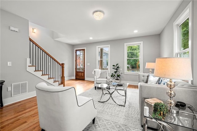 106 Hogue St, Atlanta, GA 30312 - living area with light wood-type flooring, recessed lighting, baseboards, and stairway