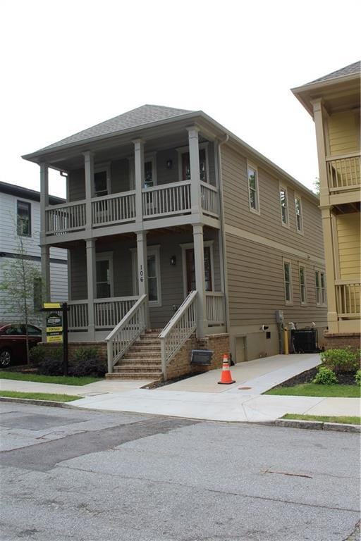 106 Hogue St, Atlanta, GA 30312 - view of front of house with a balcony, covered porch, and central AC unit