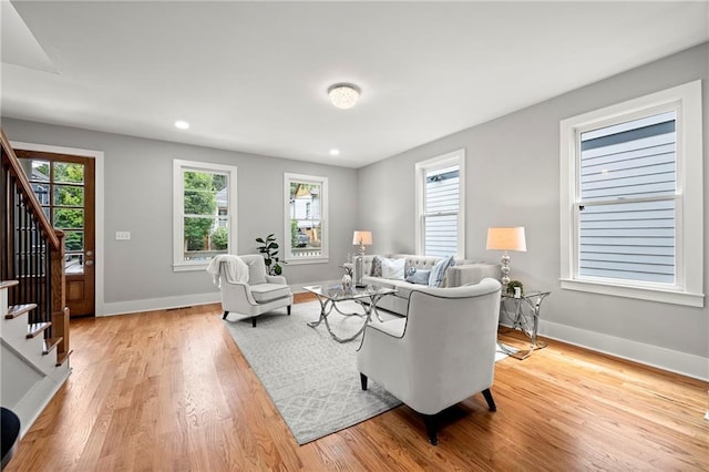 106 Hogue St, Atlanta, GA 30312 - living room featuring stairway, light wood-style floors, baseboards, and recessed lighting