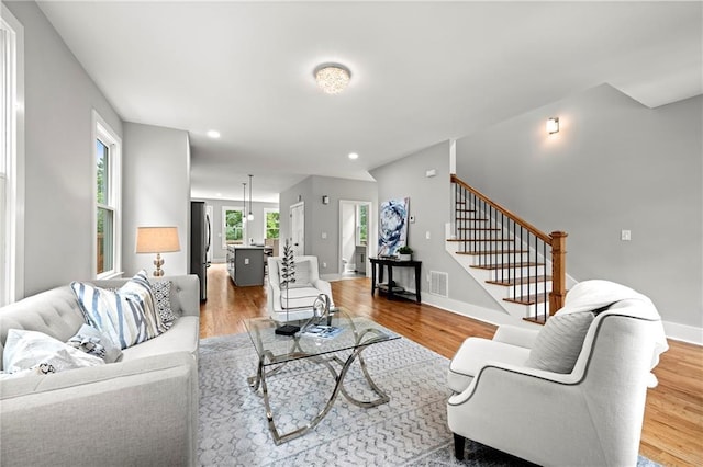 106 Hogue St, Atlanta, GA 30312 - living area with stairway, light wood-type flooring, baseboards, and recessed lighting