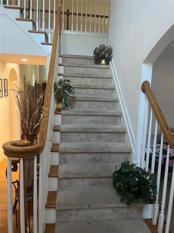 947 Simonton View Ln, Lawrenceville, GA 30045 - staircase featuring arched walkways and wood finished floors