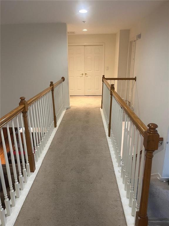 947 Simonton View Ln, Lawrenceville, GA 30045 - hallway with an upstairs landing, carpet floors, recessed lighting, and baseboards