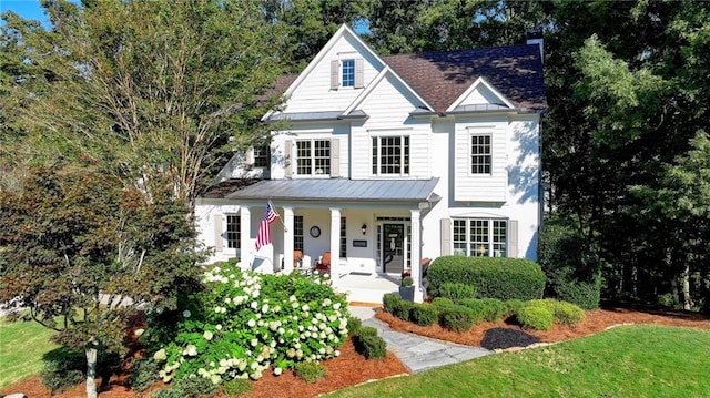 view of front of home with a front lawn and covered porch