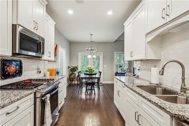 297 Cobblestone Trl, Dallas, GA 30132 - kitchen featuring stainless steel appliances, white cabinets, dark wood-style floors, backsplash, and recessed lighting