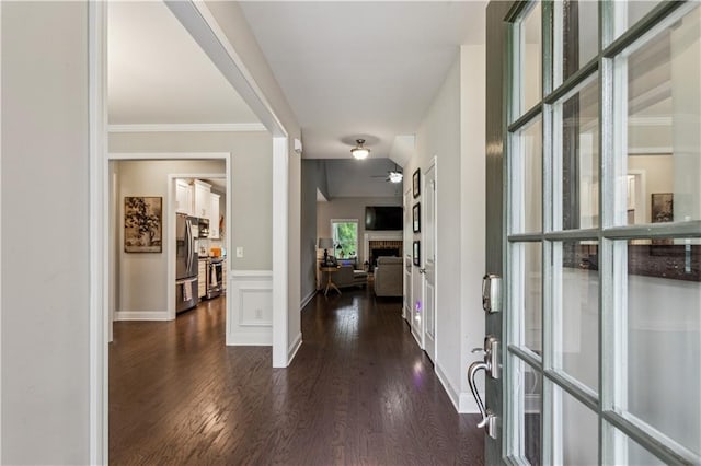 297 Cobblestone Trl, Dallas, GA 30132 - foyer featuring dark wood finished floors, a fireplace, and ornamental molding