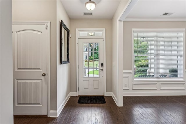 297 Cobblestone Trl, Dallas, GA 30132 - foyer entrance featuring dark wood-style floors, healthy amount of natural light, and crown molding