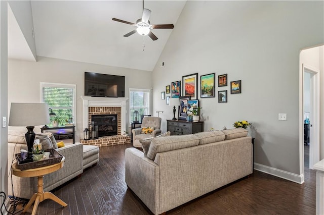 297 Cobblestone Trl, Dallas, GA 30132 - living area featuring plenty of natural light, high vaulted ceiling, ceiling fan, a brick fireplace, and dark wood-style flooring