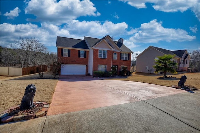 view of front of property with a garage and a front lawn