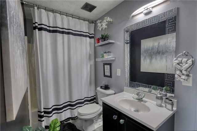 full bathroom with vanity, shower / bath combo with shower curtain, and toilet