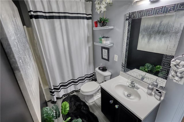 full bathroom with vanity, shower / bathtub combination with curtain, and toilet