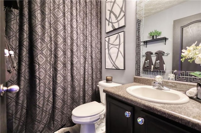 bathroom with vanity and toilet