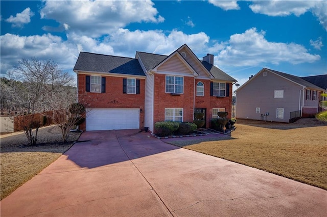 view of front of property with a garage and a front lawn