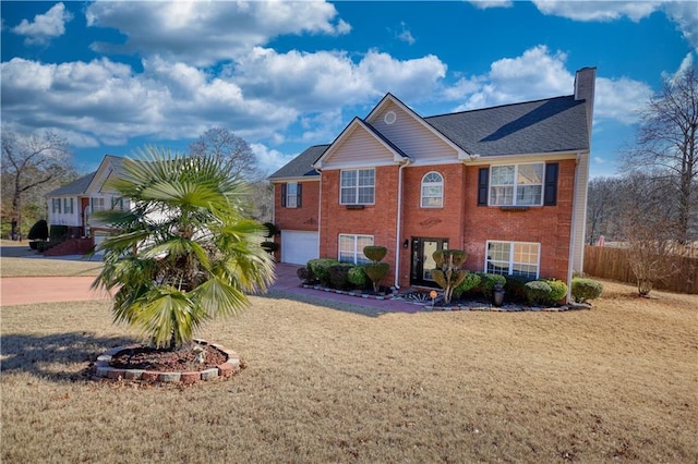 view of front of home with a garage and a front yard