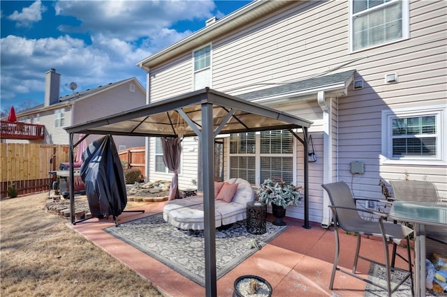 view of patio with a grill and a gazebo