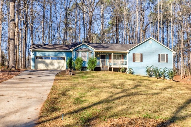 ranch-style house featuring a garage, a front yard, and covered porch