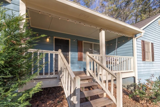 doorway to property featuring covered porch