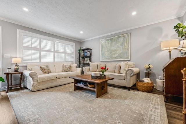 living area with wood finished floors, crown molding, and recessed lighting
