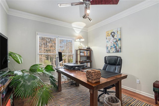 office area with ornamental molding, wood finished floors, a ceiling fan, and baseboards