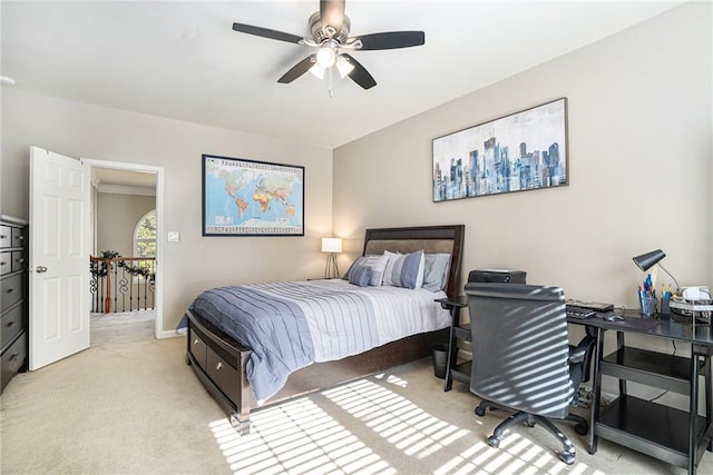 bedroom featuring light carpet and ceiling fan