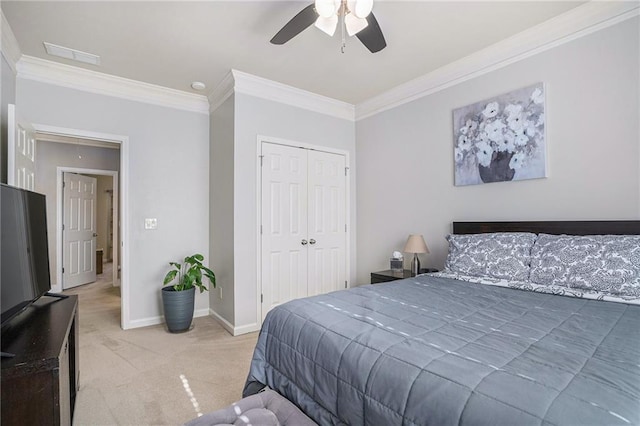 bedroom featuring light colored carpet, visible vents, baseboards, ornamental molding, and a closet