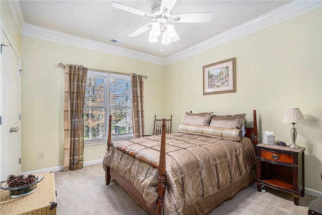 bedroom featuring carpet flooring, a ceiling fan, visible vents, baseboards, and crown molding