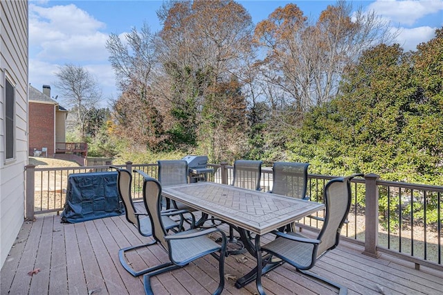 wooden terrace with outdoor dining space