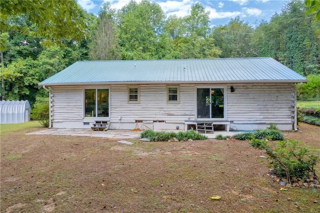 168 Silver Fox Dr, Dawsonville, GA 30534 - rear view of house featuring a patio and metal roof
