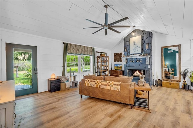 168 Silver Fox Dr, Dawsonville, GA 30534 - living room featuring a ceiling fan, wood finished floors, a lit fireplace, and vaulted ceiling