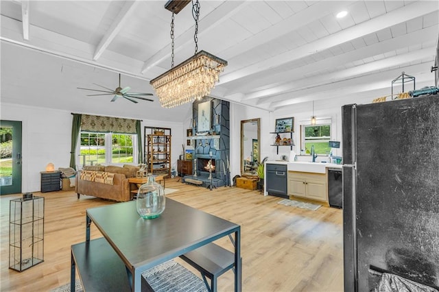 168 Silver Fox Dr, Dawsonville, GA 30534 - living area featuring light wood finished floors, ceiling fan, beamed ceiling, and healthy amount of natural light