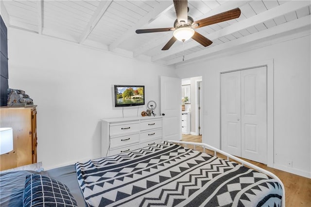 168 Silver Fox Dr, Dawsonville, GA 30534 - bedroom featuring light wood finished floors, wood ceiling with exposed beams, ceiling fan, and a closet