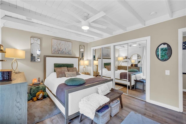 168 Silver Fox Dr, Dawsonville, GA 30534 - bedroom with wood finished floors, wooden ceiling with exposed beams, and baseboards