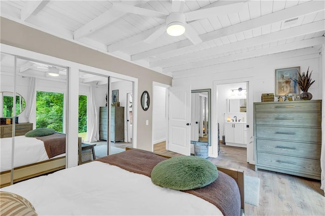 168 Silver Fox Dr, Dawsonville, GA 30534 - bedroom with light wood-style flooring, two closets, ensuite bath, and wood ceiling with exposed beams