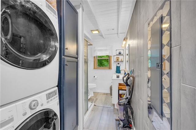 168 Silver Fox Dr, Dawsonville, GA 30534 - laundry room featuring stacked washer and clothes dryer