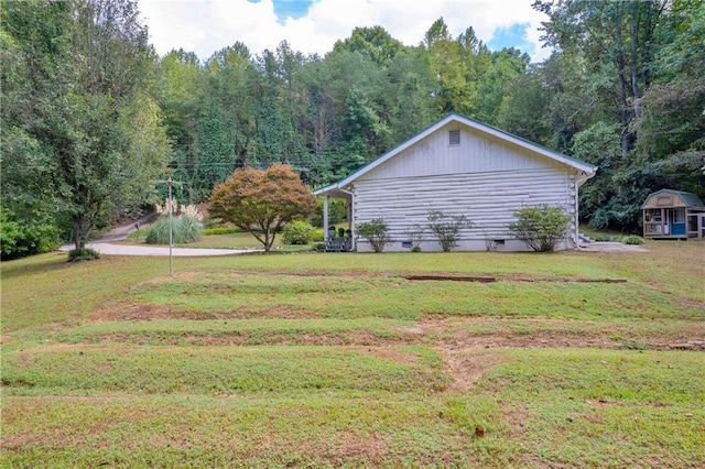 168 Silver Fox Dr, Dawsonville, GA 30534 - view of side of property featuring crawl space, a lawn, and an outdoor structure