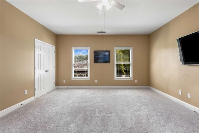 895 Ovalene Ln SW, Marietta, GA 30064 - unfurnished room with carpet flooring, a wealth of natural light, visible vents, and a ceiling fan