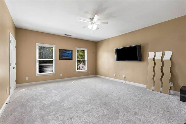 895 Ovalene Ln SW, Marietta, GA 30064 - unfurnished living room with baseboards, carpet flooring, visible vents, and ceiling fan