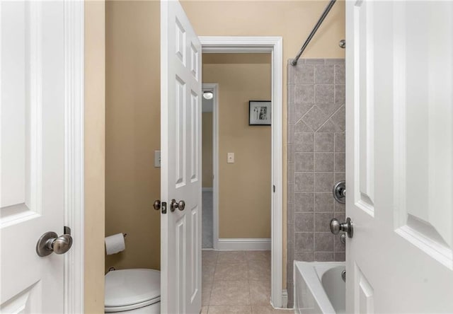 895 Ovalene Ln SW, Marietta, GA 30064 - bathroom with toilet, baseboards, tile patterned flooring, and shower / bath combination