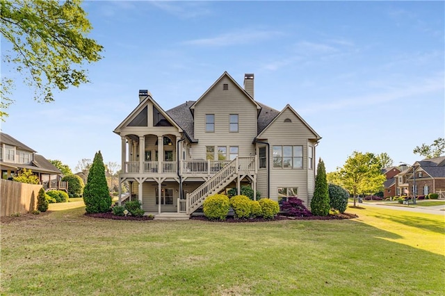 895 Ovalene Ln SW, Marietta, GA 30064 - rear view of house featuring a chimney, stairs, a porch, and a lawn