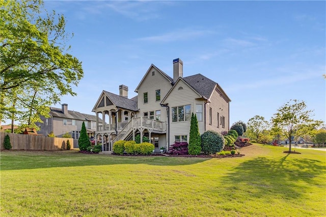 895 Ovalene Ln SW, Marietta, GA 30064 - rear view of house featuring a yard, a deck, stairway, and fence