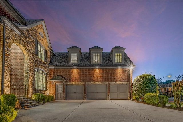 895 Ovalene Ln SW, Marietta, GA 30064 - view of front of home featuring stone siding, concrete driveway, a garage, and brick siding